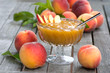 Peach jam in a glass bowl
