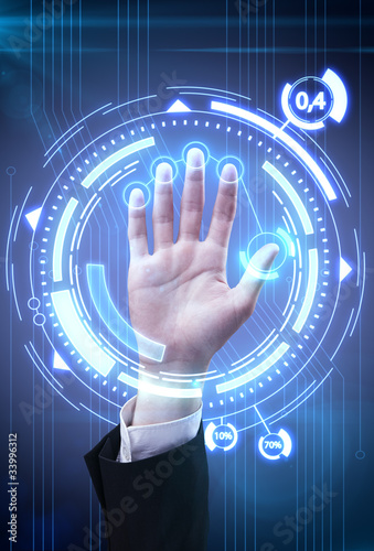 Photo: Technology scan man's hand for security or identification Technology scan man's hand for security or identification