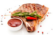 Closeup of grilled steak with peper corns and rosemary