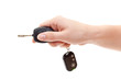 Hand with car keys. Isolated on white. Inserting key
