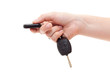Hand with alarm keys pushing the button. Isolated on white