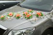Car with decorations from flower for driving bride and groom