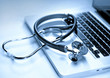 Photo: Medical stethoscope on a laptop, closeup Medical stethoscope on a laptop, closeup