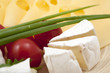 Various types of cheese on a wooden board Various types of cheese on a wooden board