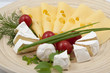 Various types of cheese on a wooden board Various types of cheese on a wooden board