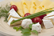 Various types of cheese on a wooden board Various types of cheese on a wooden board