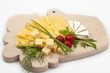 Various types of cheese on a wooden board Various types of cheese on a wooden board