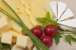 Various types of cheese on a wooden board Various types of cheese on a wooden board