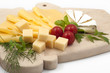 Various types of cheese on a wooden board Various types of cheese on a wooden board