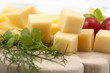 Various types of cheese on a wooden cutting board Various types of cheese on a wooden cutting board