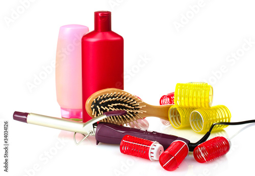 Photo: curling irons, curlers and comb isolated on white curling irons, curlers and comb isolated on white