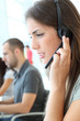 Customer service employee with headphones on