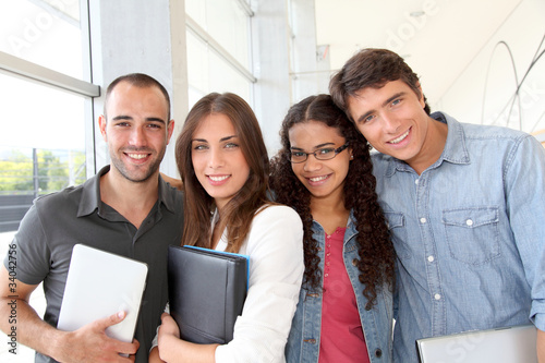 Photo: Portrait of cheeful college students Portrait of cheeful college students