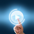finger drückt play-button