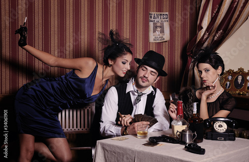 Photo: Gambling mafia type with cigarette, playing poker. Gambling mafia type with cigarette, playing poker.