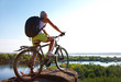 Photo: Girl with bicycle on mountain Girl with bicycle on mountain