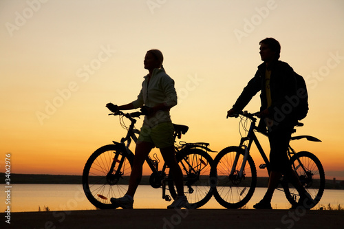 Photo: Couple of bicycles on sunset Couple of bicycles on sunset