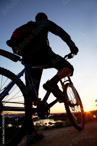 Photo: silhouette of bicycle on sunrise silhouette of bicycle on sunrise