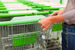 Woman in supermarket with shopping cart