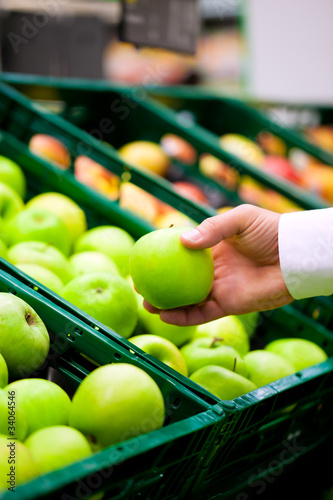 Photo: Man in supermarket shopping groceries Man in supermarket shopping groceries