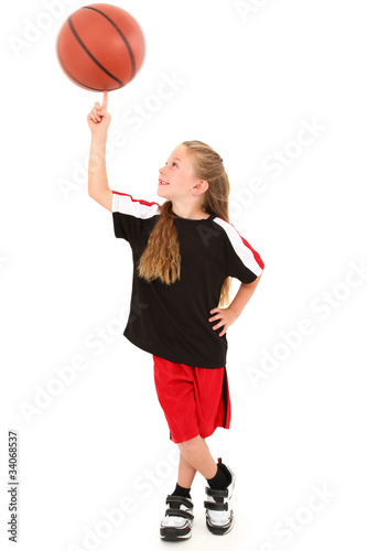 Photo: Proud Girl Child Basketball Player Spinning Ball on Finger Proud Girl Child Basketball Player Spinning Ball on Finger