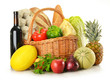 Groceries in wicker basket isolated on white Groceries in wicker basket isolated on white