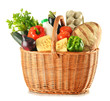 Groceries in wicker basket isolated on white Groceries in wicker basket isolated on white