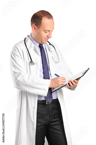 Photo: Medical doctor writing down notes Medical doctor writing down notes
