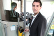 A young controller in a bus.