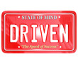 Driven Word on Red License Plate - Driving to Success