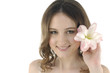 Shot of a young beautiful woman with a lily flower