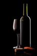 bottle with red wine and glass and cork with a corkscrew