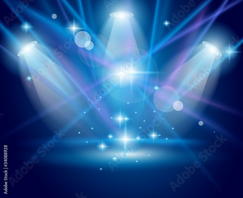 Vector: Magic Spotlights with Blue rays and glowing effect Magic Spotlights with Blue rays and glowing effect
