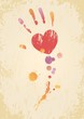 Grunge page with the heart-shaped hand print and color spatters