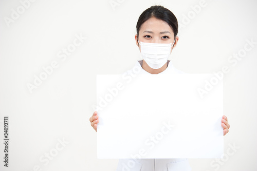 Photo: beautiful asian nurse holding a blank whiteboard beautiful asian nurse holding a blank whiteboard