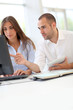 Young adults in training course using touchpad Young adults in training course using touchpad