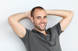 Portrait of relaxed man leaning on wall