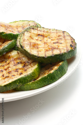 Photo: Grilled zucchini on а plate Grilled zucchini on а plate
