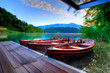 Foto: Boats on alpine lake in early morning Boats on alpine lake in early morning