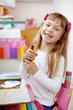 Little kid girl painting