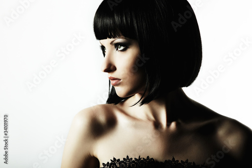 Photo: Fashion portrait of a young beautiful dark-haired woman Fashion portrait of a young beautiful dark-haired woman