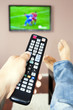Men with the remote control, front of the television.