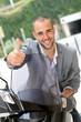 Man going to work on motorcycle
