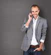 Cool businessman talking on mobile phone