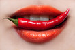 Фото: Woman lips and chili pepper Woman lips and chili pepper