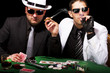 two gangsters playing some cards