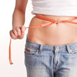 Girl is measuring her waist