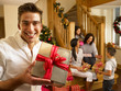 Photo: Hispanic family exchanging gifts at Christmas Hispanic family exchanging gifts at Christmas