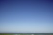 Sea against clear blue sky