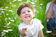 Girl holding daisy